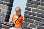 Chinese Boy Posing Before The Great Wall, Beijing, China