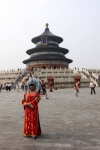 Chinese Woman Posing Before the Hall of Prayer for Good Harvest at the Temple of Heaven, Beijing, China